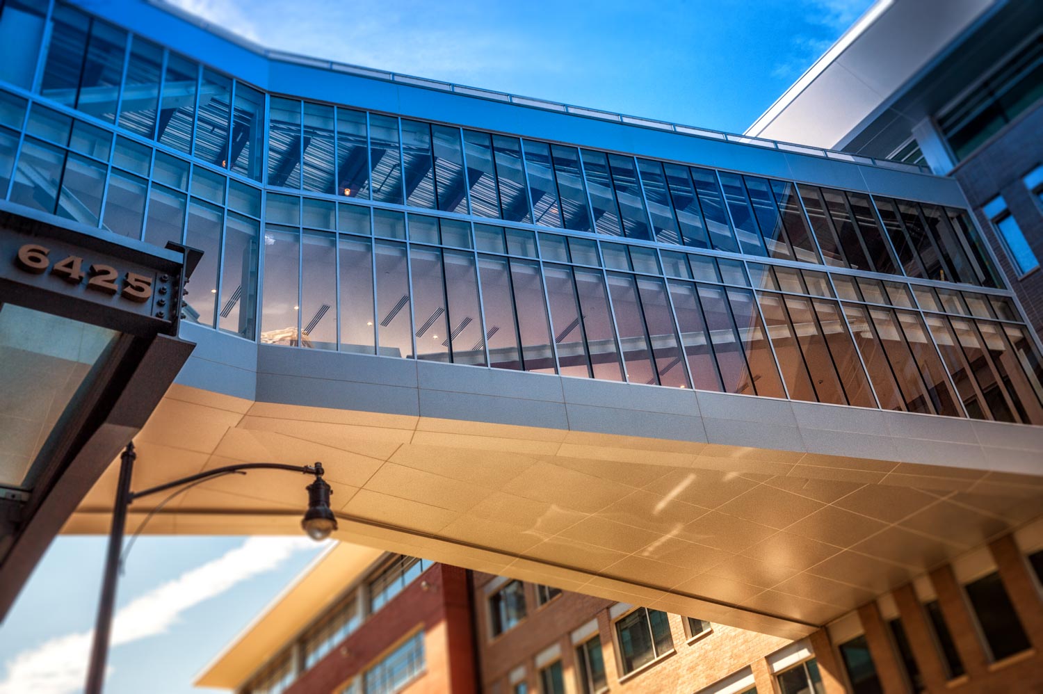 Walk way above Penn Ave. across Bakery Living made with architectural gray panels