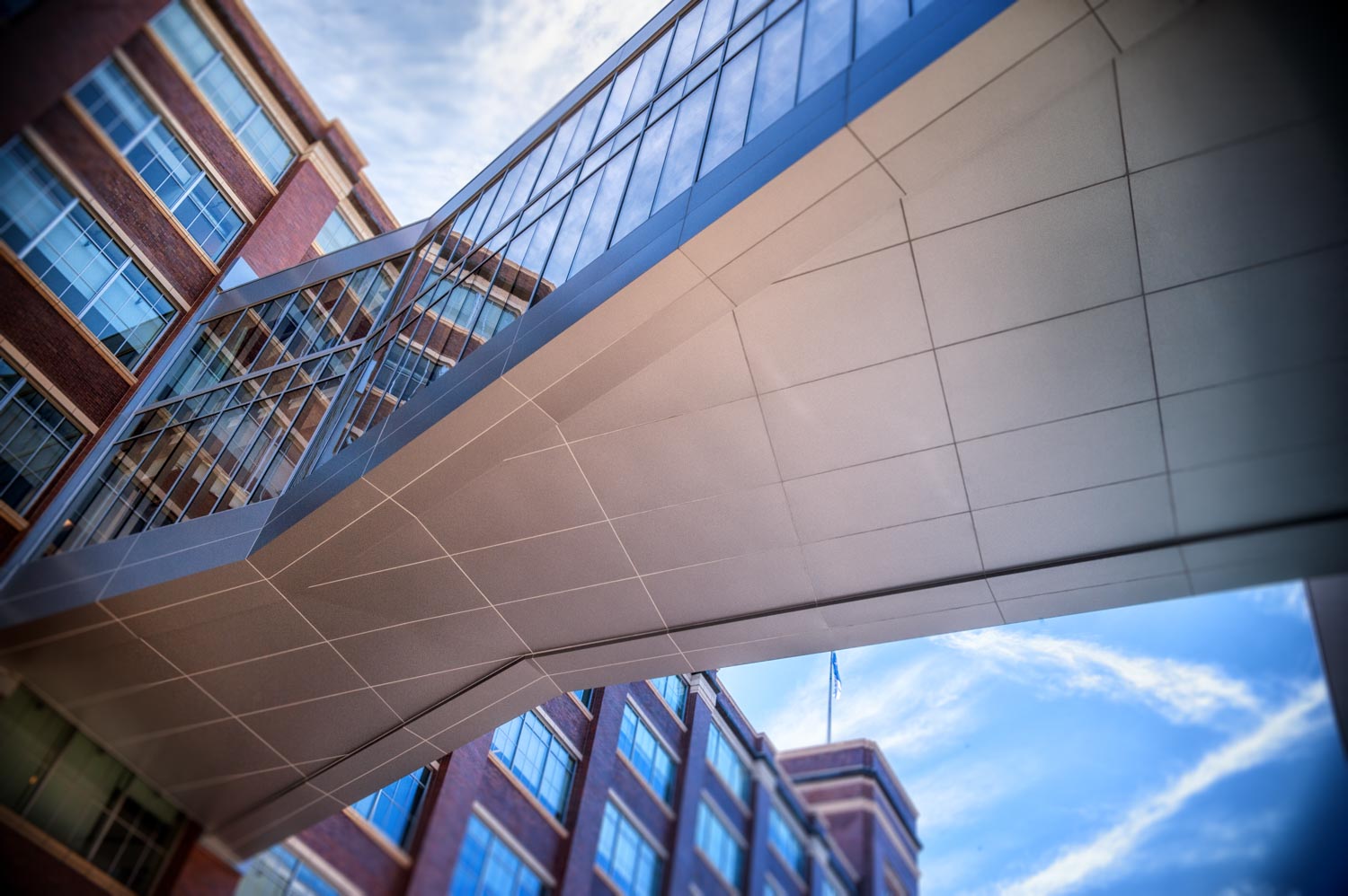 Walk way above Penn Ave. across come Bakery Living made with architectural gray panels