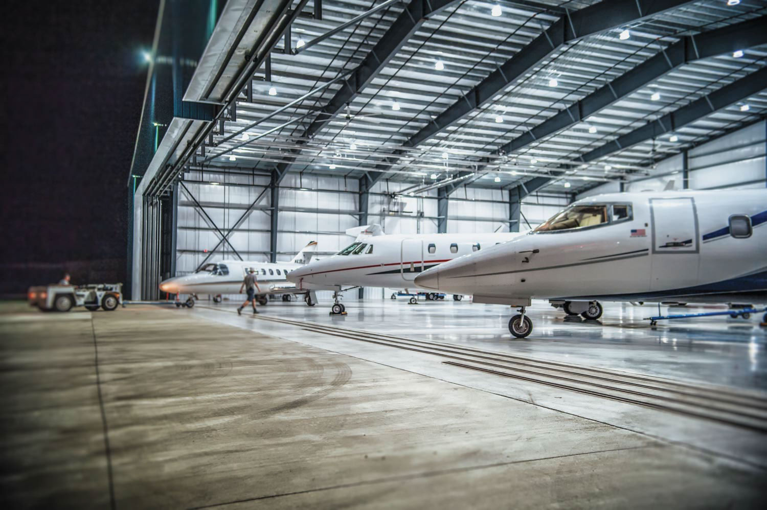 Air plane hanger night time photograph Air plane hanger night time photograph L J & Associates